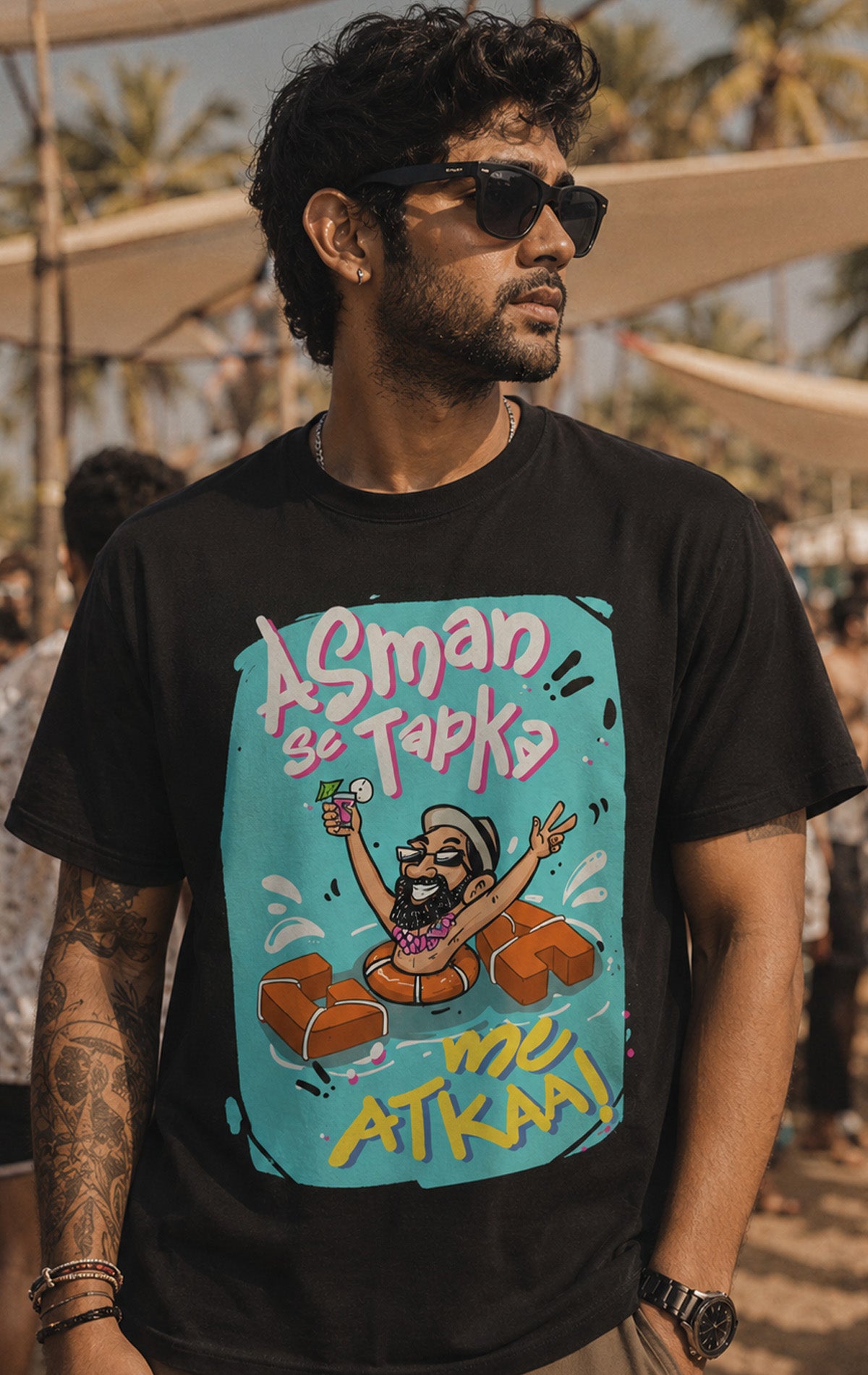 black men's beachwear t-shirt displaying a quirky Goa trip graphic with blue and yellow typography