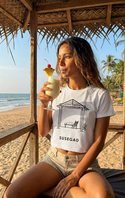 A minimalist black and white line art illustration of a dog sleeping comfortably on a traditional wooden bench under a tiled roof structure (balcão). The word "SUSEGAD" is written in bold, clean capital letters underneath. The background is a light grey.