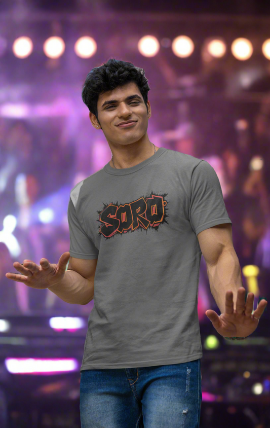 Model wearing a stylish black t-shirt with bold typography design featuring the word 'SORO,' which means alcohol in Konkani, showcasing the vibrant Goan culture. Perfect for casual outings and nightlife